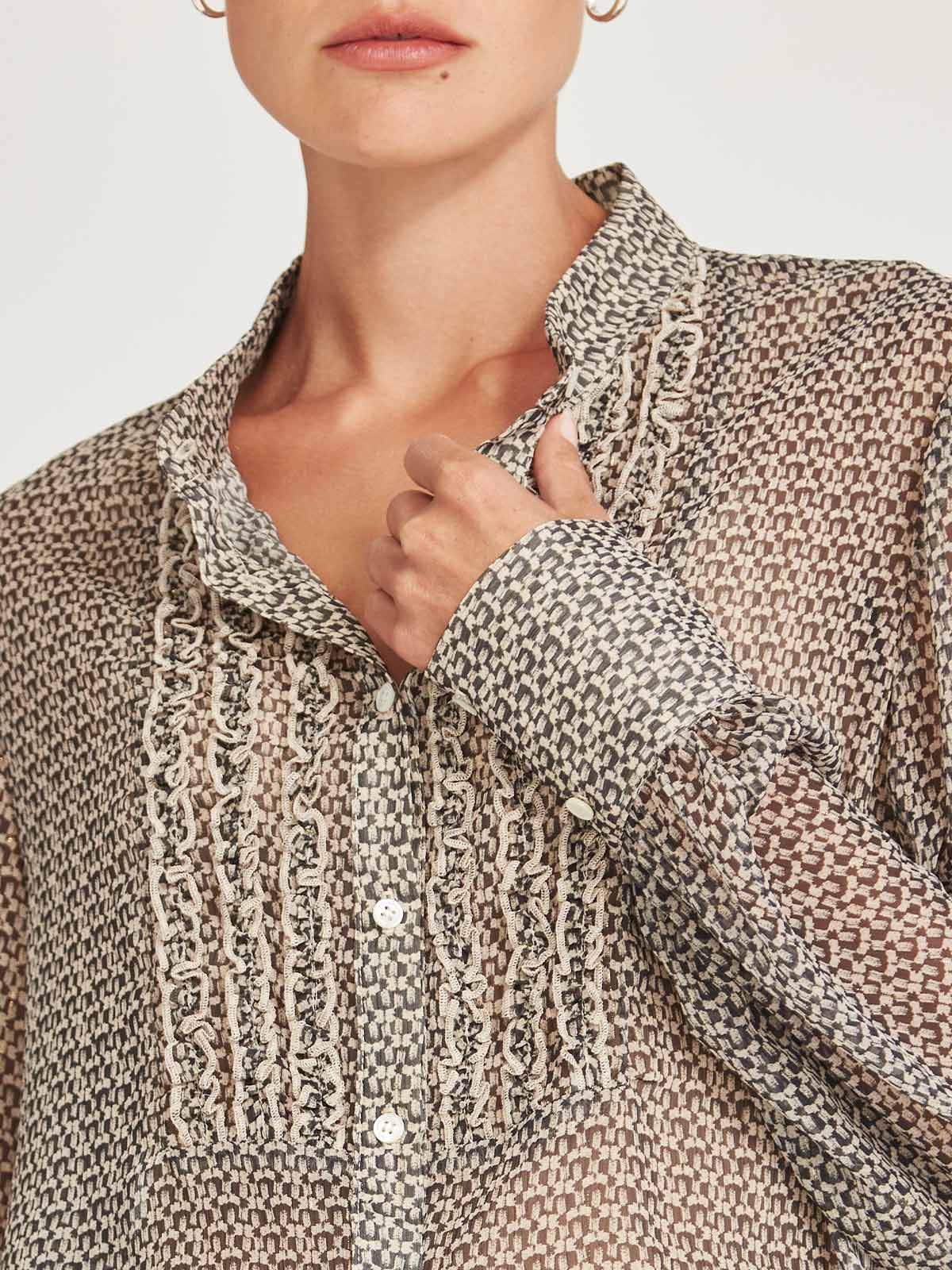 Close-up of the cuff and Mandarin collar detail of the Caroline Sills Dauphine Blouse in sand print.