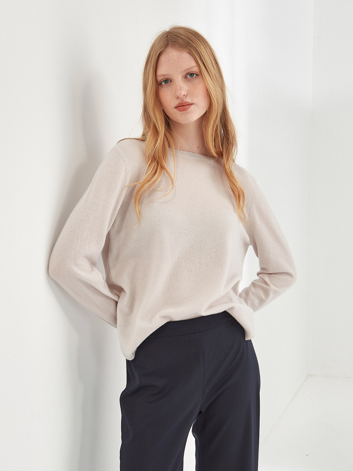 Close up of woman wearing Caroline Sills luxe Eleanor crew neck Cashmere Sweater in Vapour beige colour