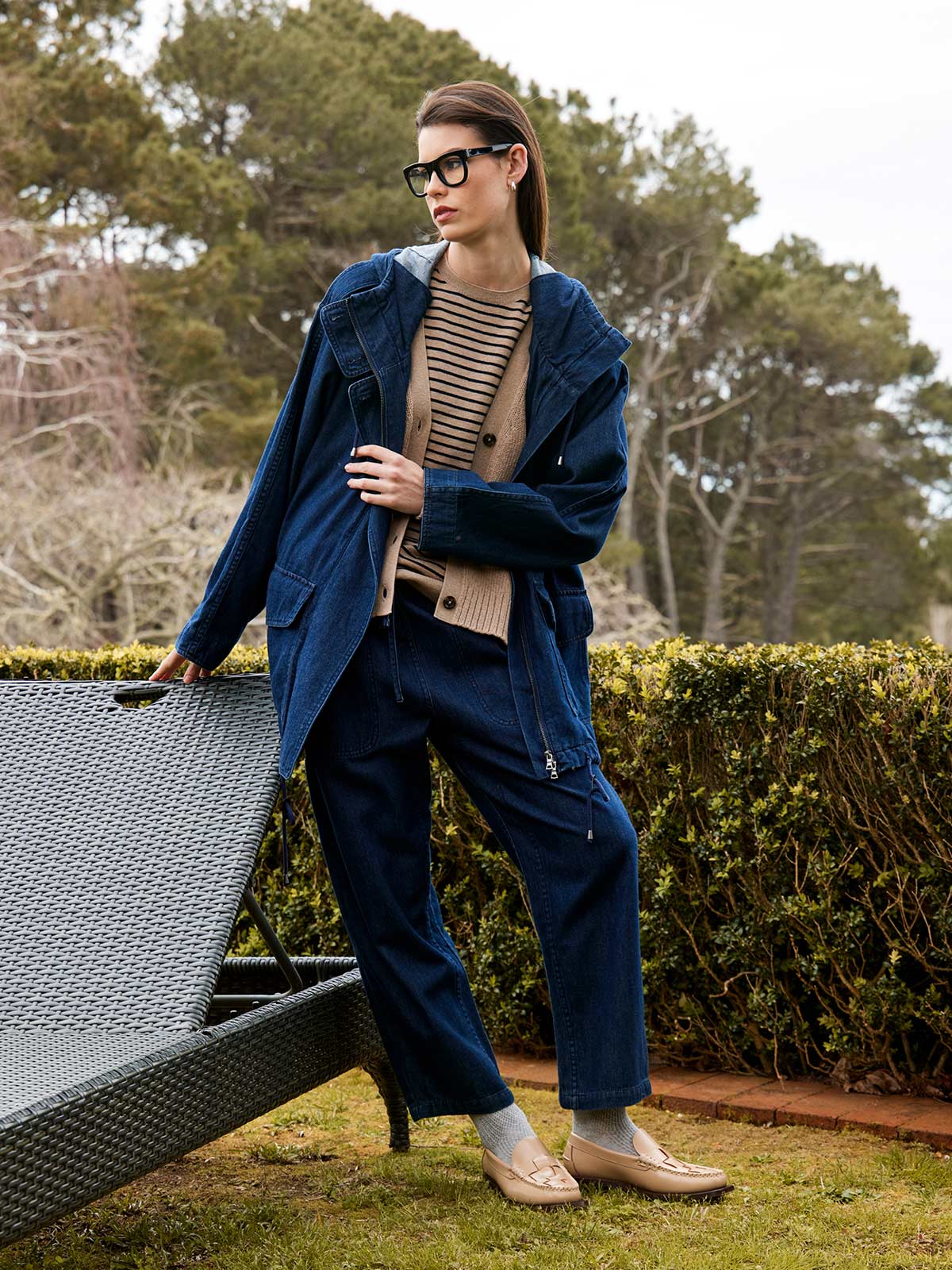 woman wearing Sills denim Ginza drawstring jean with Dover denim parka jacket and beige coloured knitwear outdoors