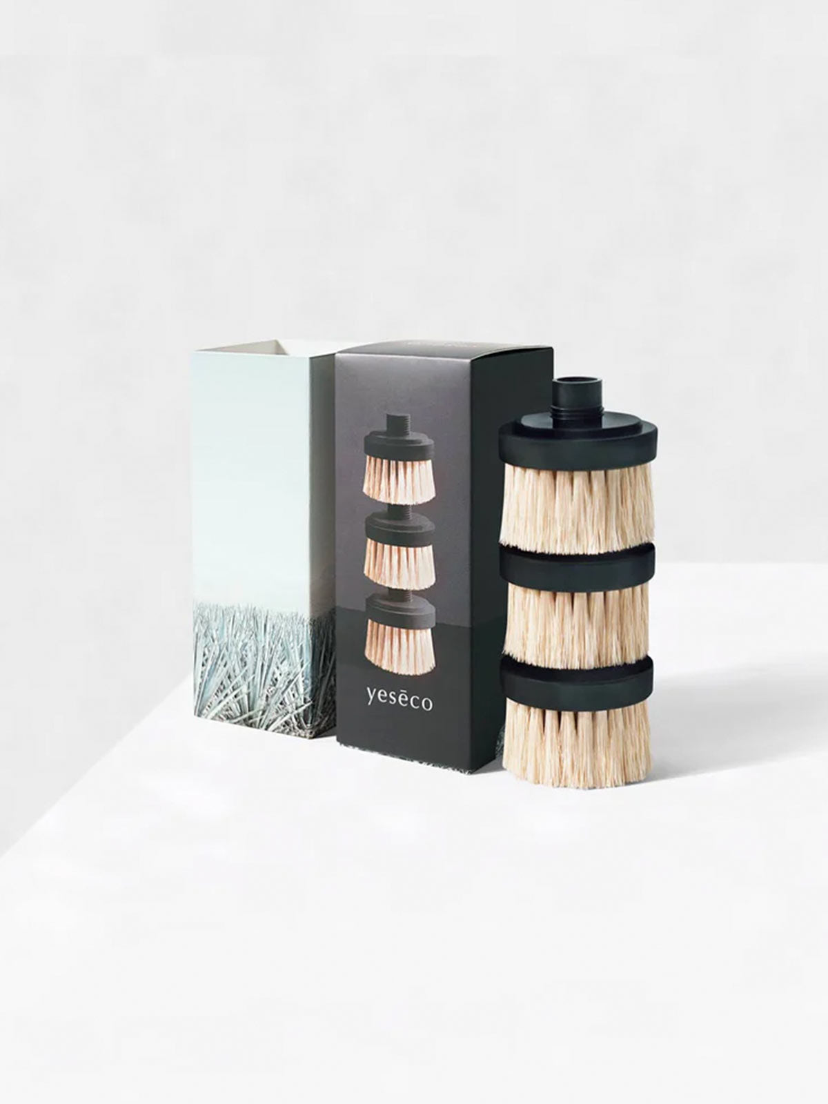 Replacement Brush Heads for The ONE BRUSH by Yeseco - Box design next to pack of three black sisal fibre brush heads, sustainable refills compatible with The ONE BRUSH magnetic dish scrubber system.
