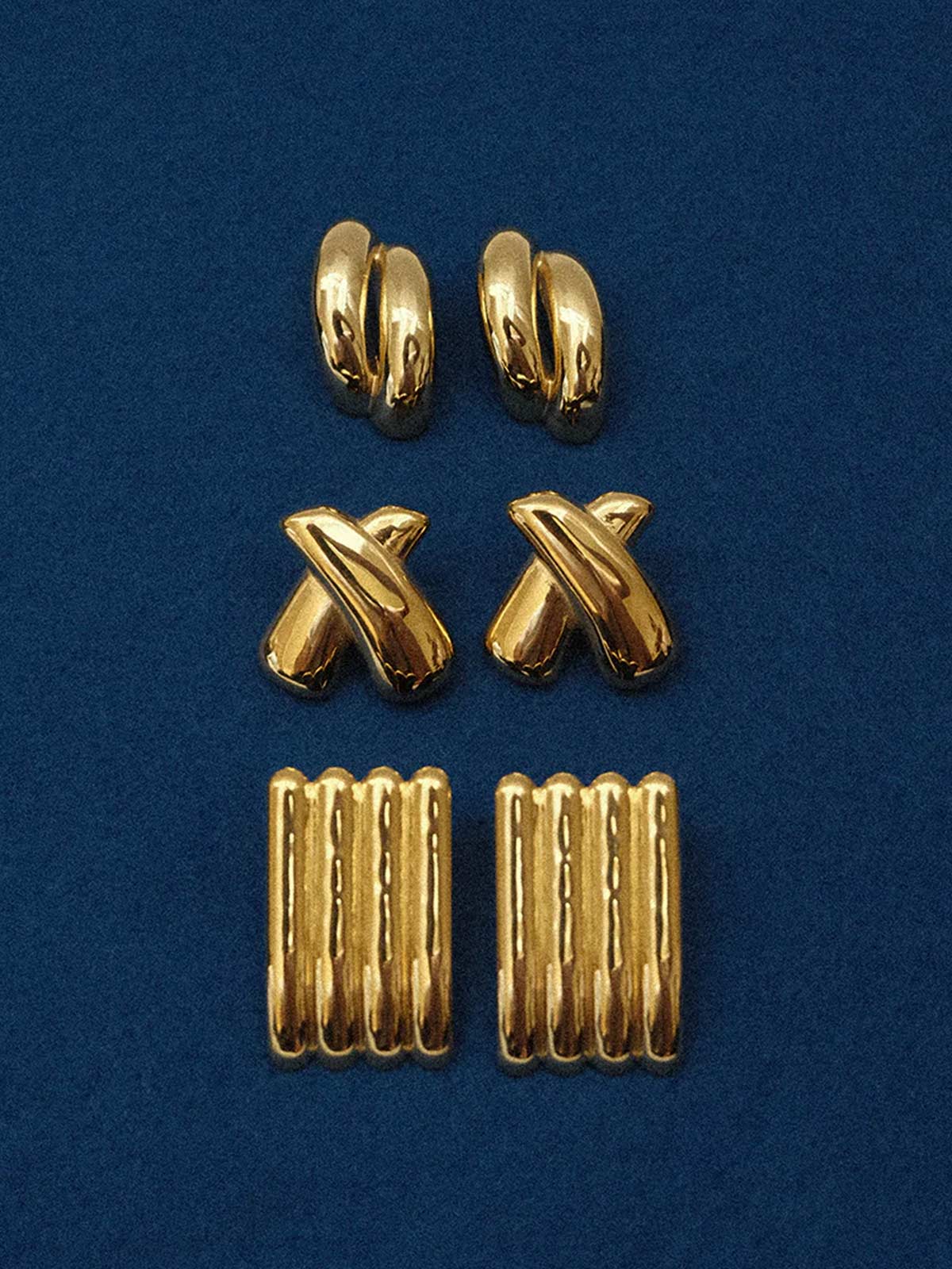 Zahar Claire gold earrings (Z266) shown from a close-up angle, featuring elegant design details and warm gold finish.