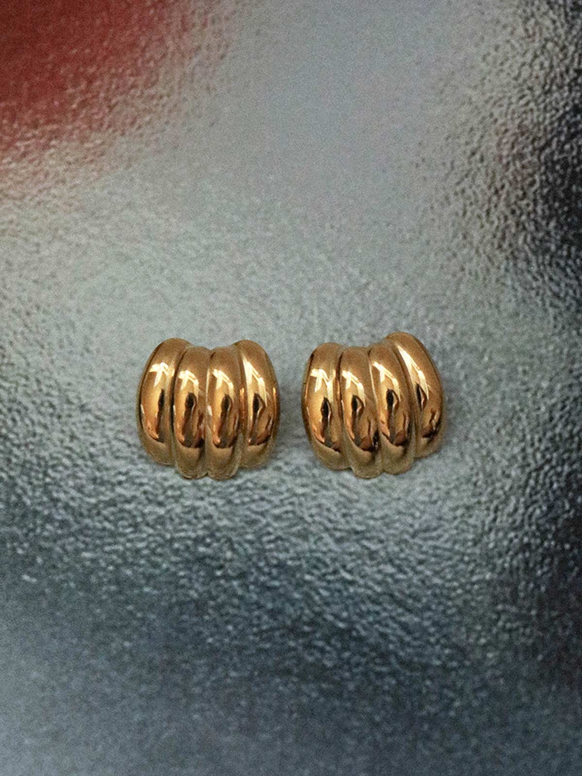 Zahar Bonnie gold earrings (Z276) shown from an overhead angle, displaying the earrings' shape and proportions with their elegant gold finish.